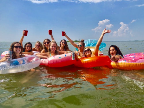 Ladies in the water on the best booze cruise in Ocean City, MD