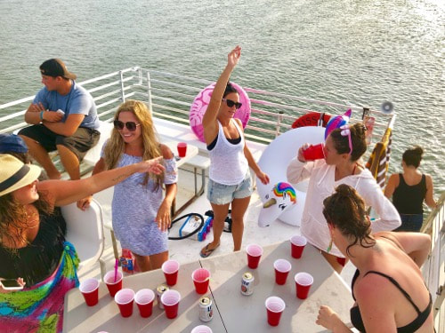 Top deck drinking games in the open bay.